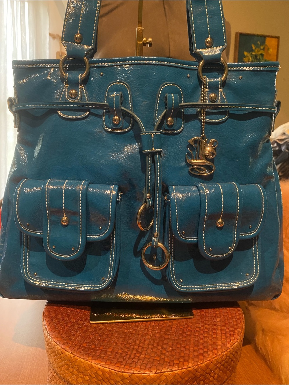Luxy Women’s bag is a vibrant blue patent leather handbag Tote